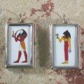 thoth and beast pendants front